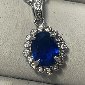 Elegant Rhodium plated and Blue Sapphire lab created Pendant Necklace